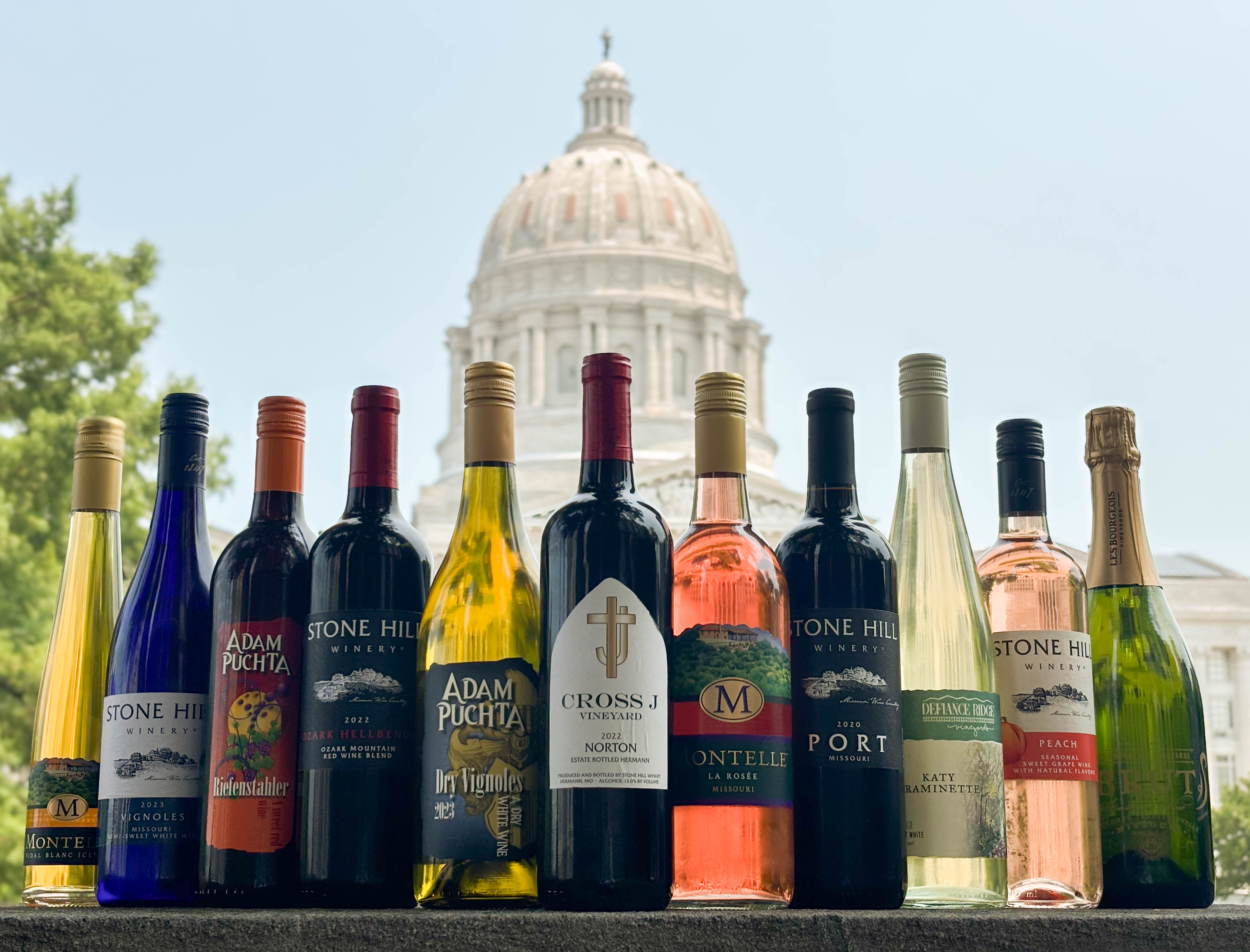 Best of Class wine bottles sitting on a ledge in front of the capital