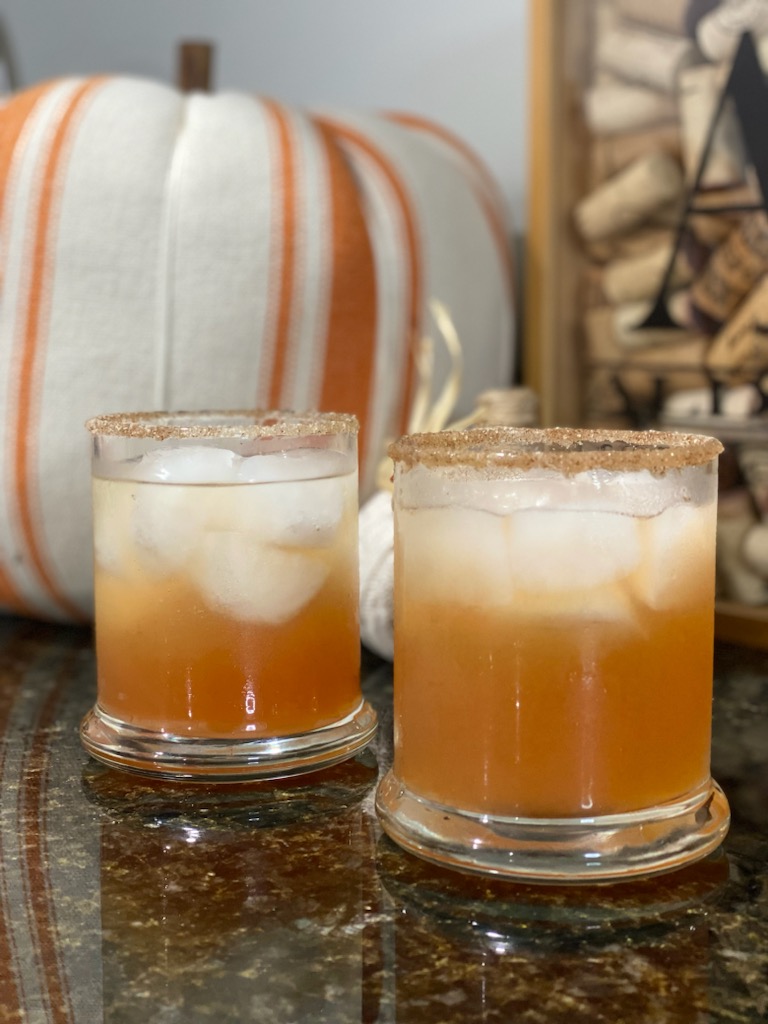 Sparkling Apple Pie In A Glass with pumpkin in the background
