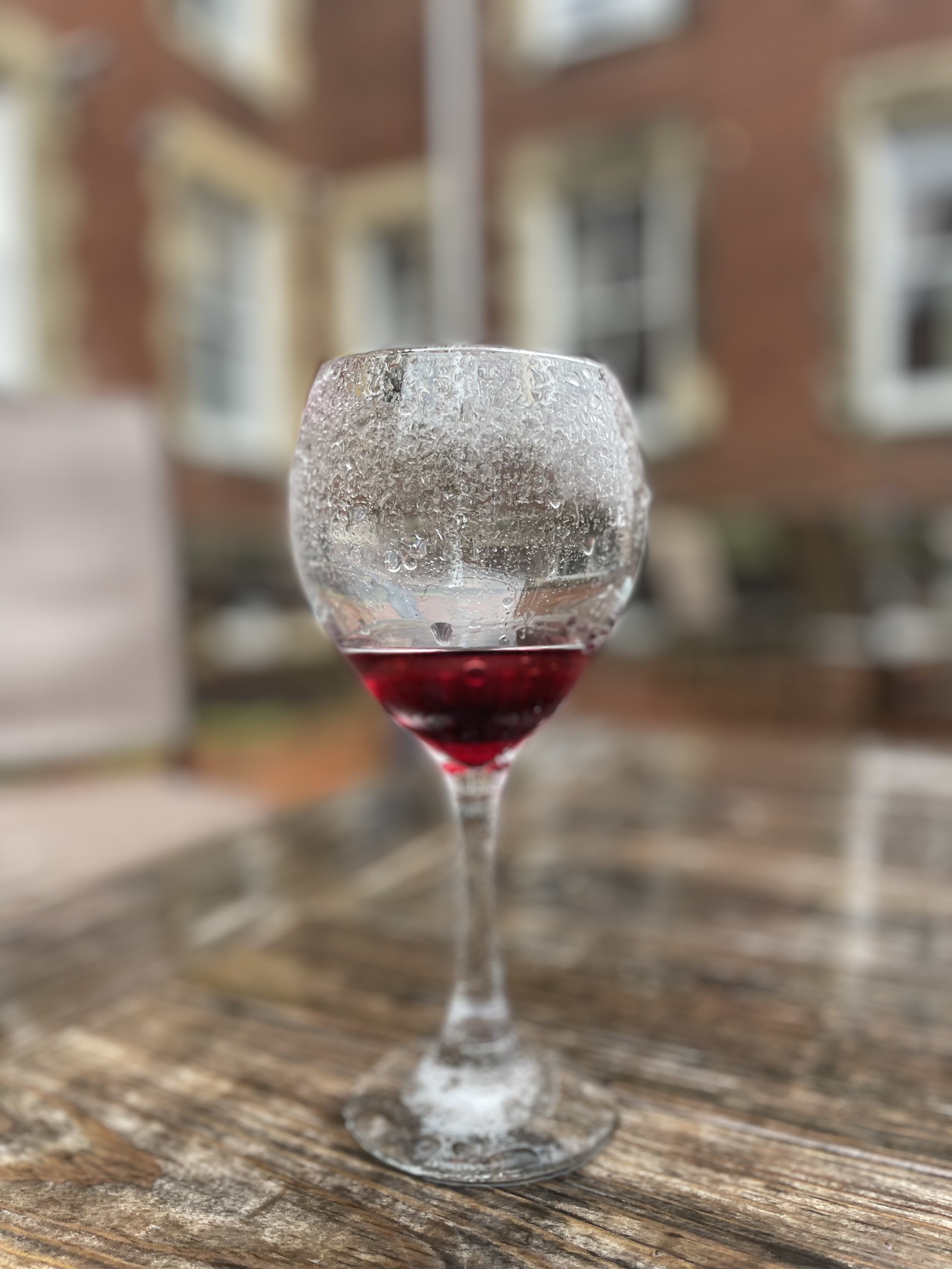 Wine glass with rain on it