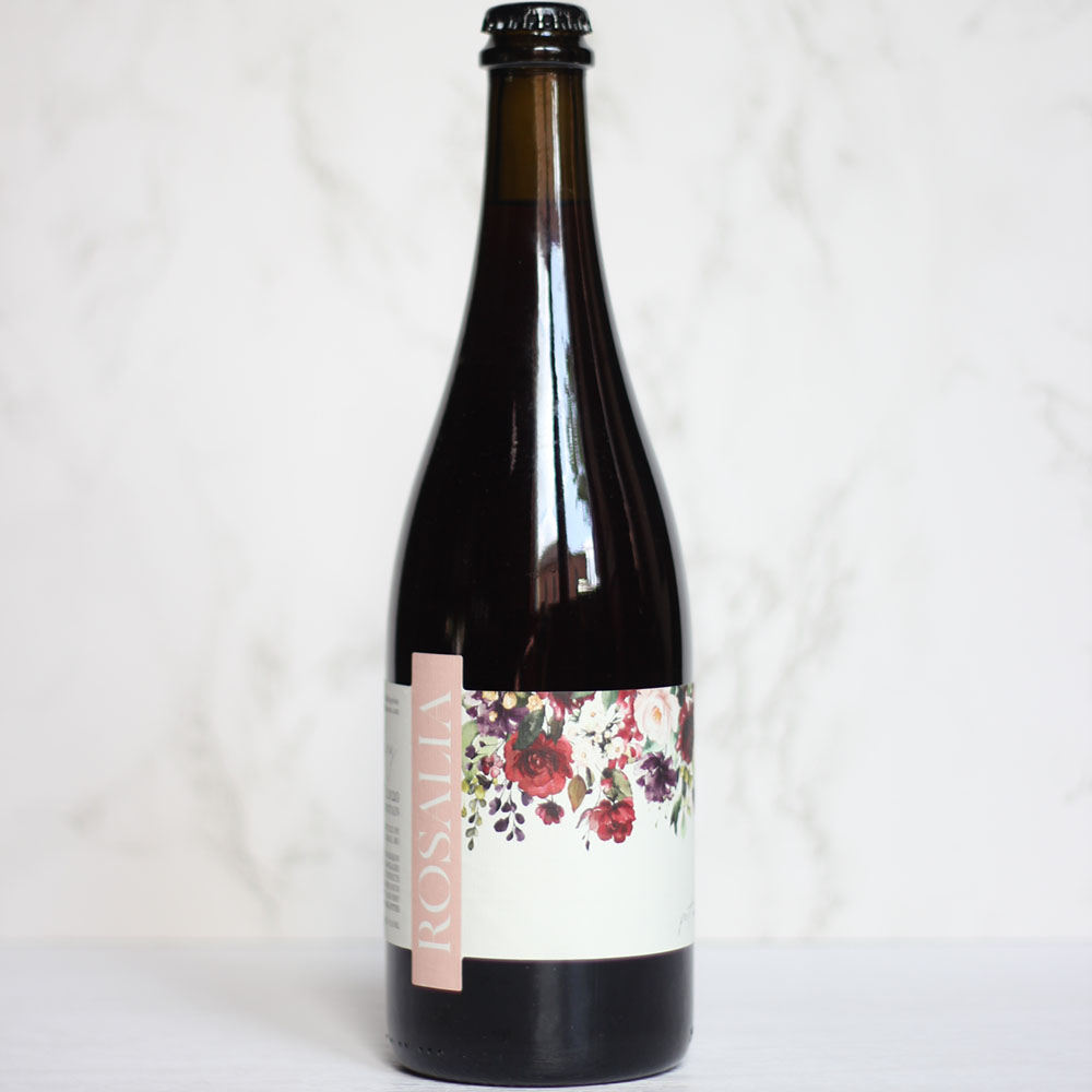 Bottle of Rosalia sparkling wine on a marble background