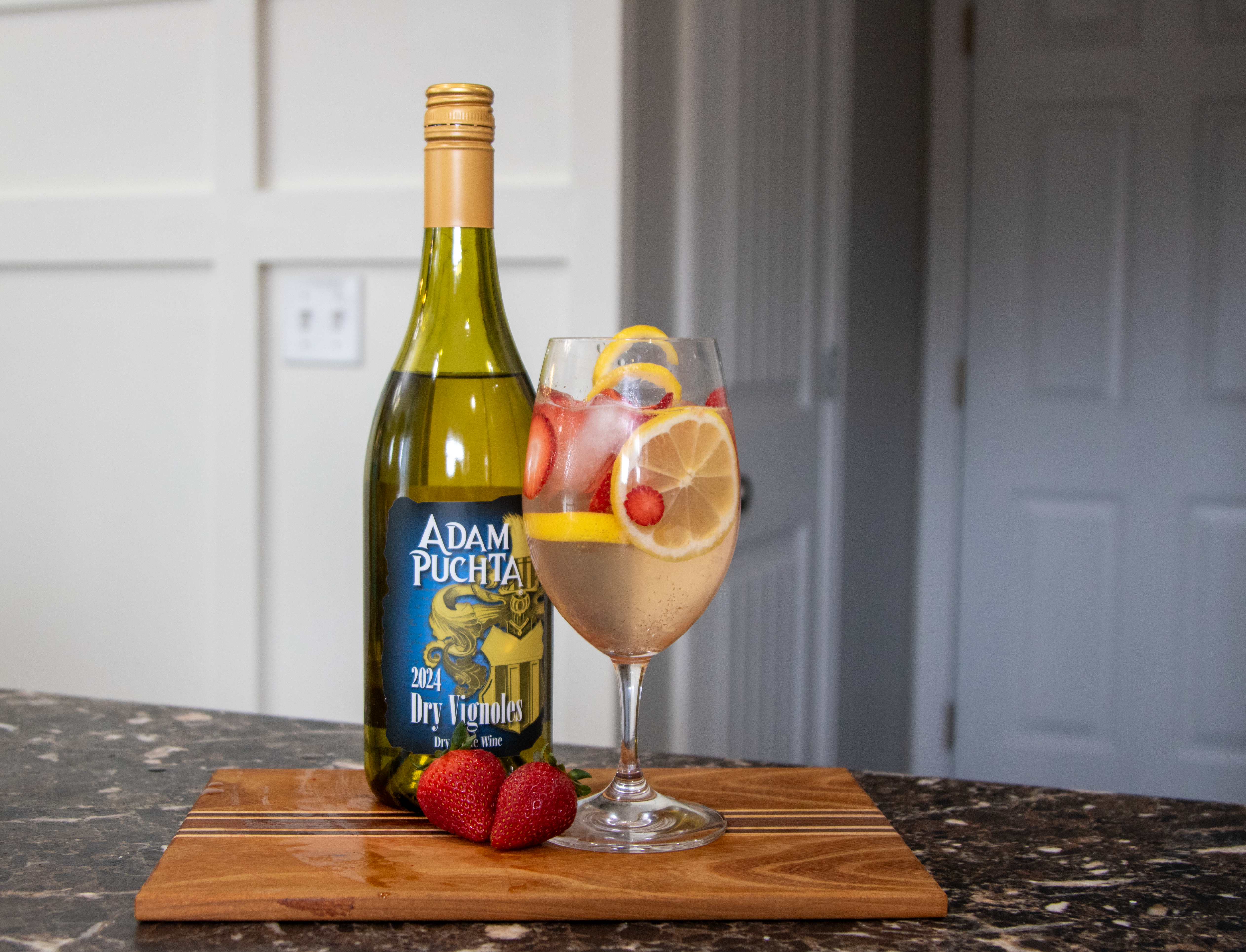 Finished Spring Sangria next to Vignoles and strawberries.