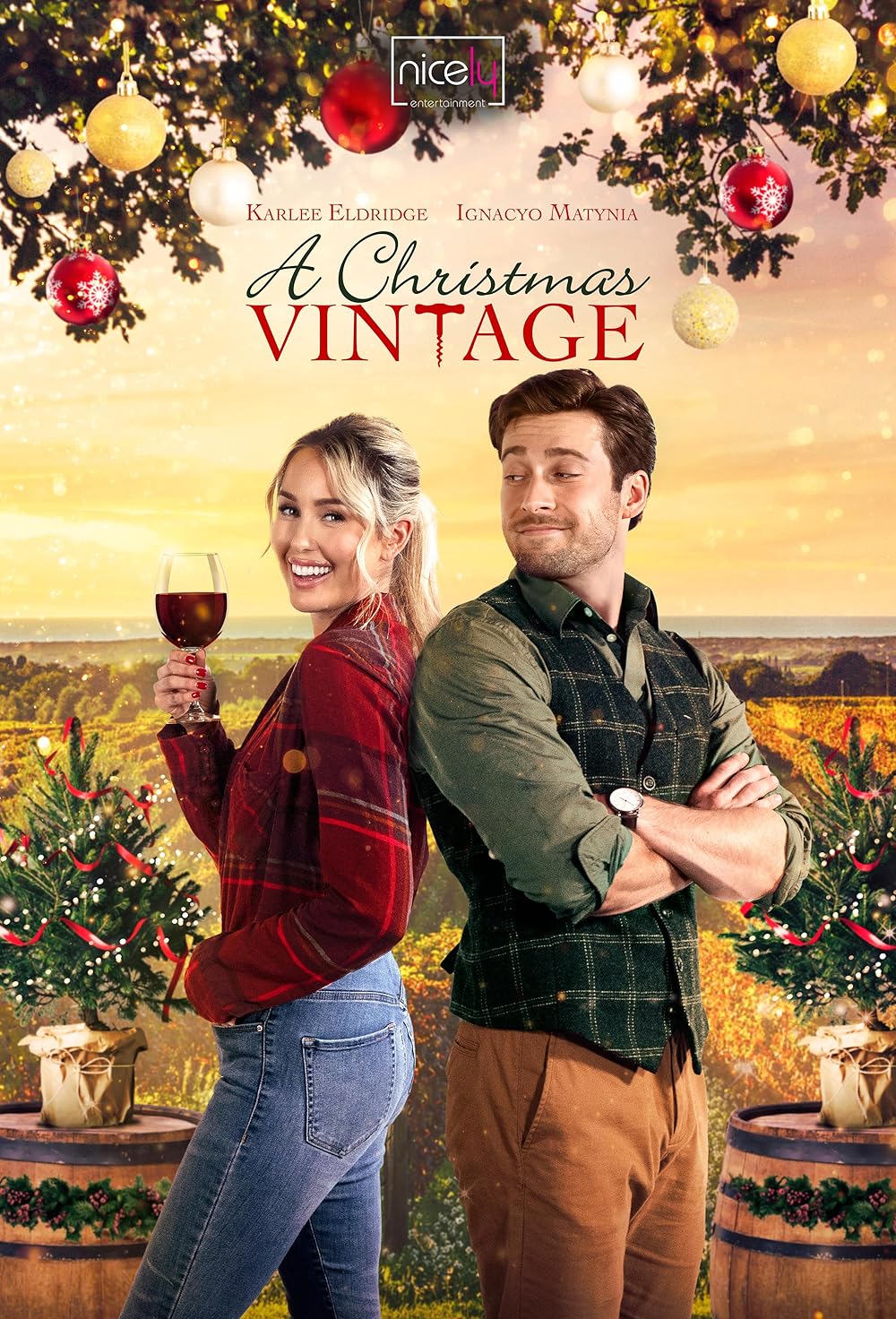 Man and woman standing back to back with a holiday background in wine country with words written over the top
