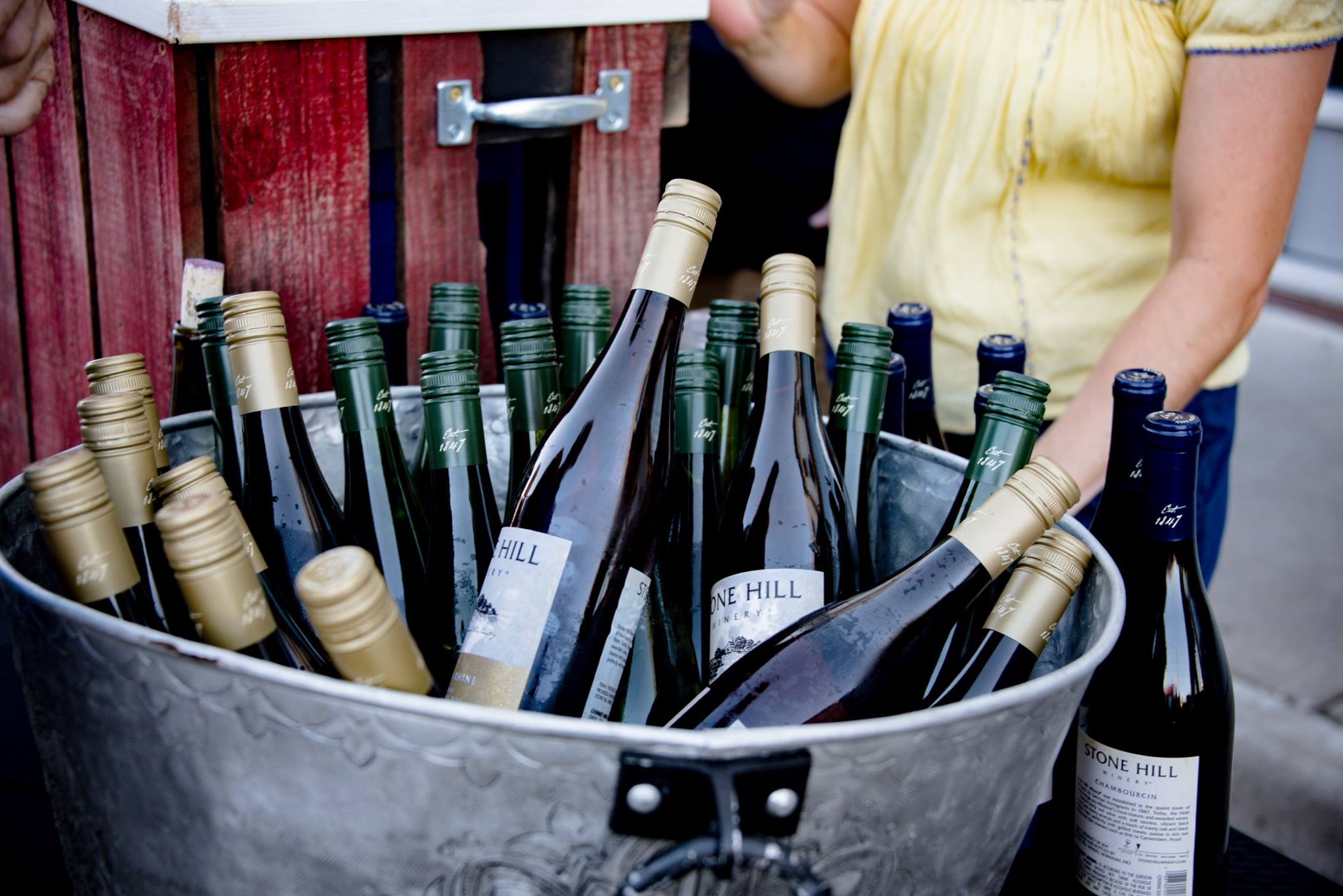 bottles of wine sitting in a ice tub